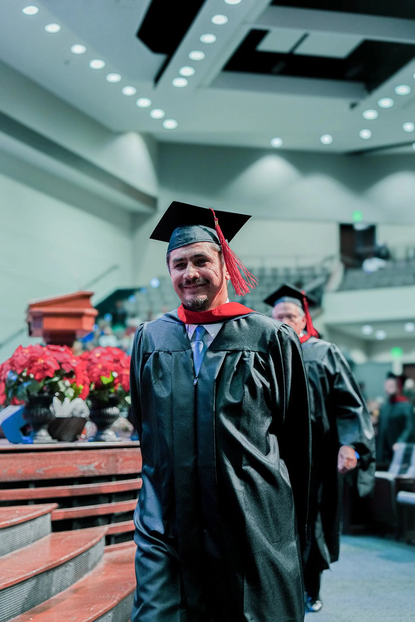 Smiling graduate at ceremony