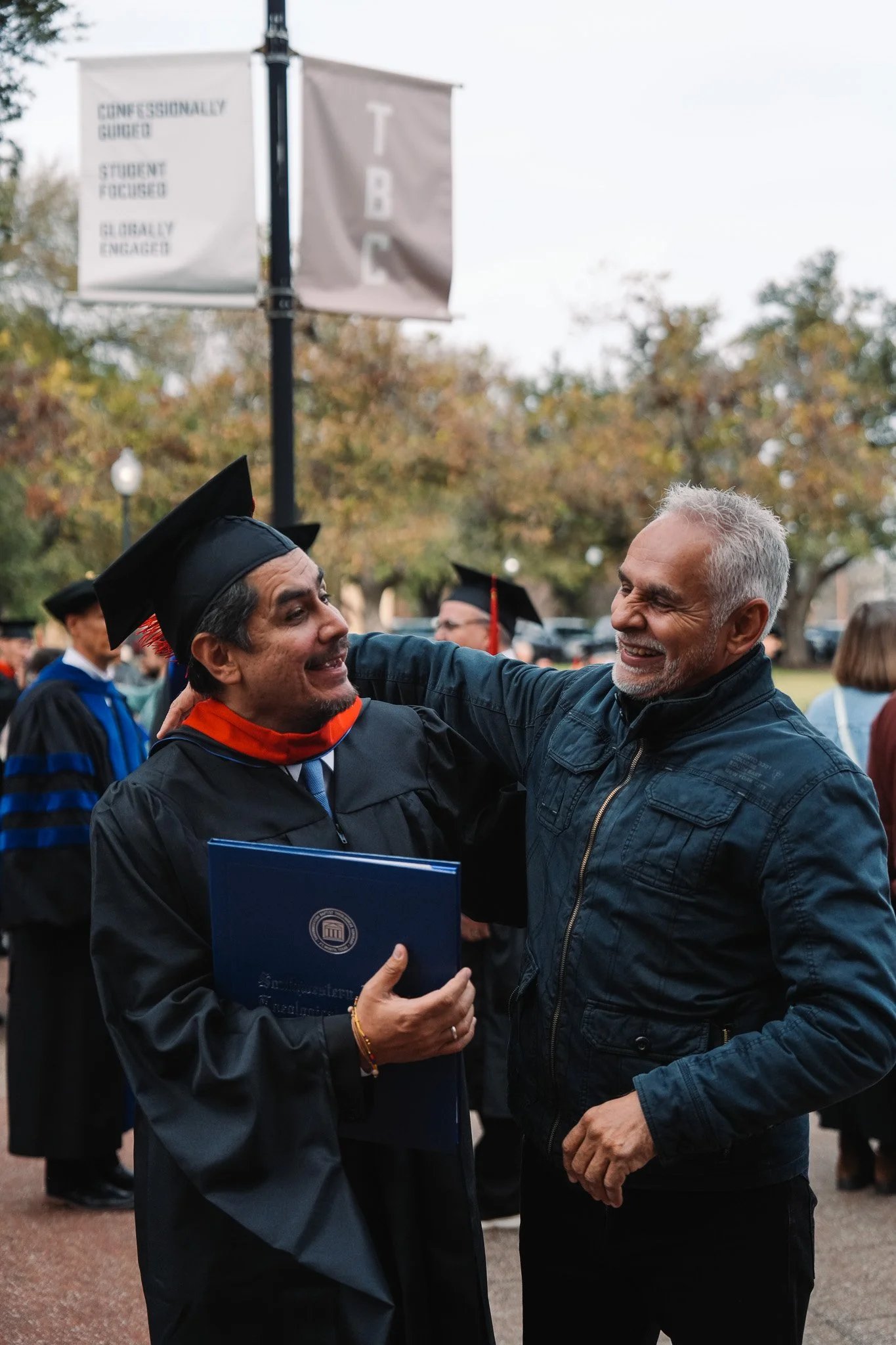 Joyful graduate celebrating outdoors