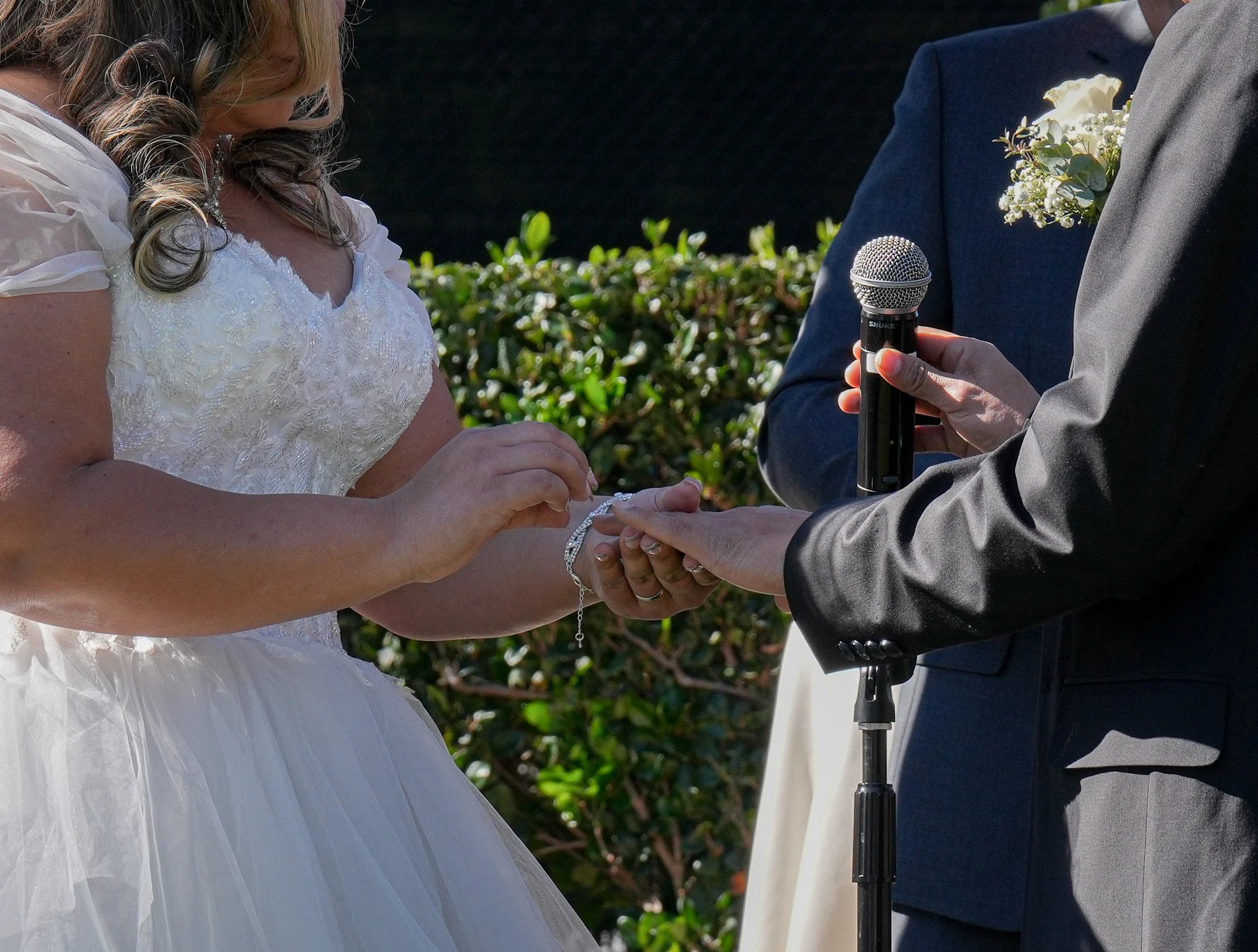 Bride and groom exchanging rings
