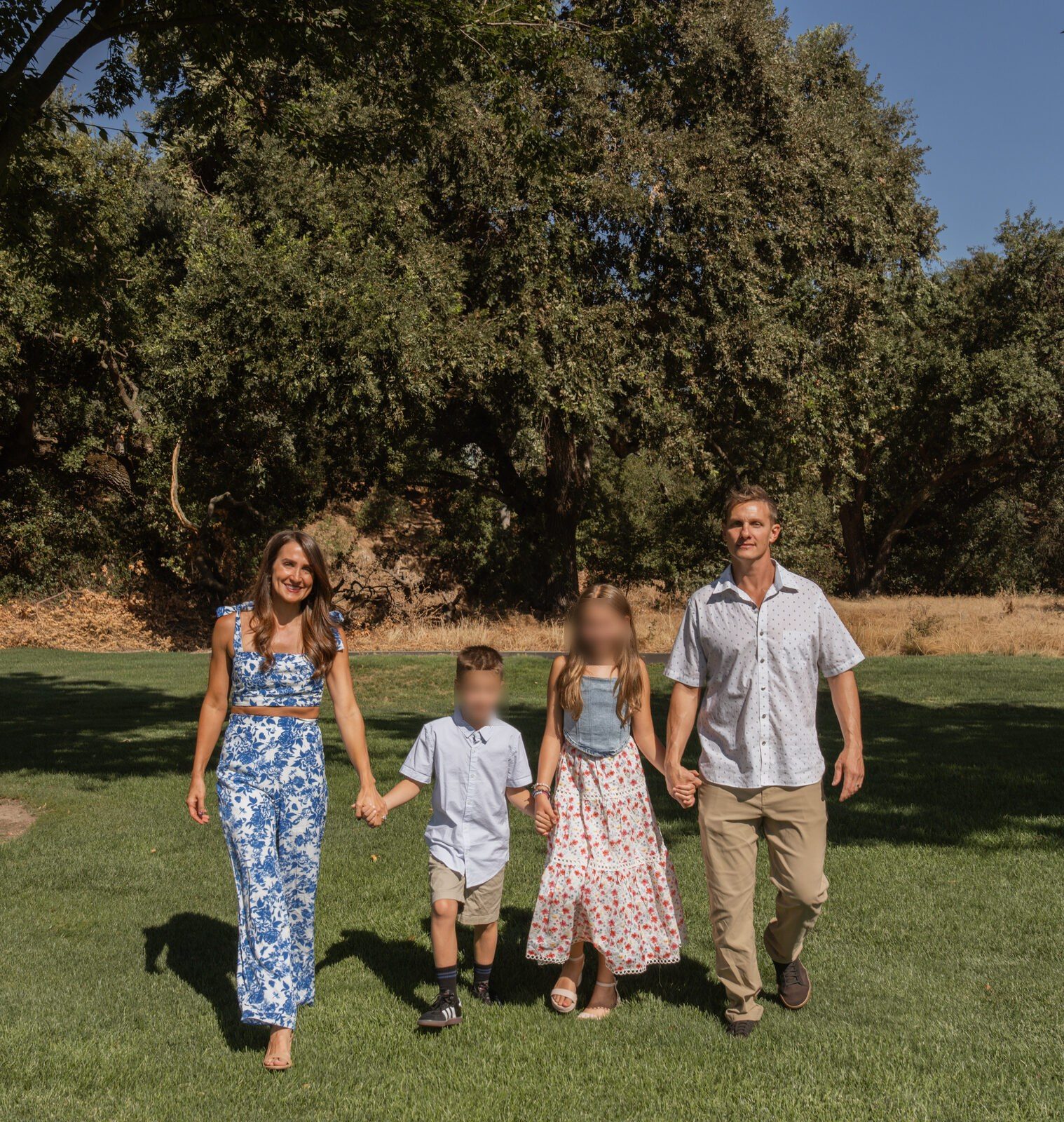 The family walking together through the park
