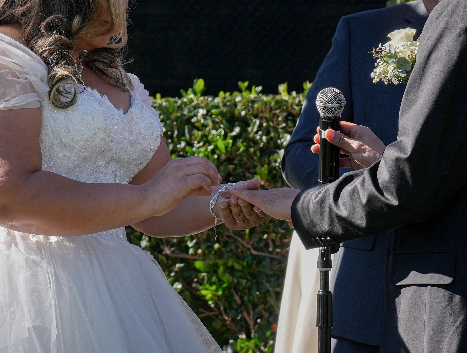 Bride and groom exchanging rings